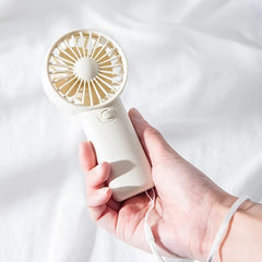 Say goodbye to the heat, Mini Pocket Fan – Portable, Adjustable & Super Cute!